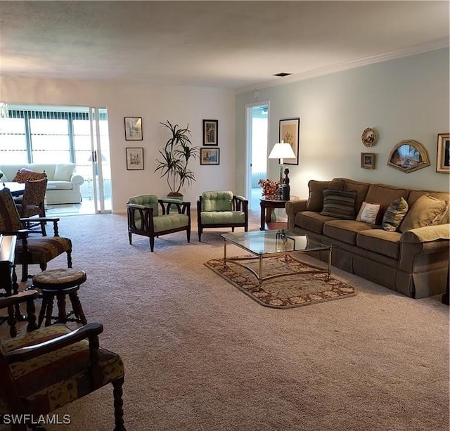 living room with carpet floors and crown molding