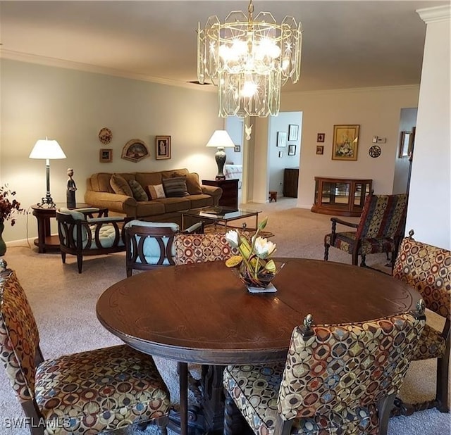 carpeted dining area featuring a notable chandelier and ornamental molding