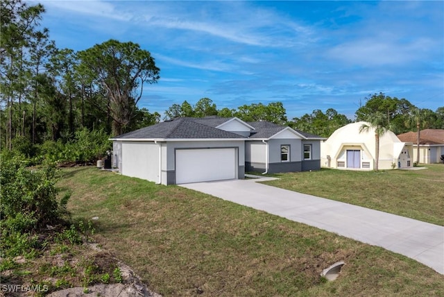 ranch-style house with a garage and a front lawn