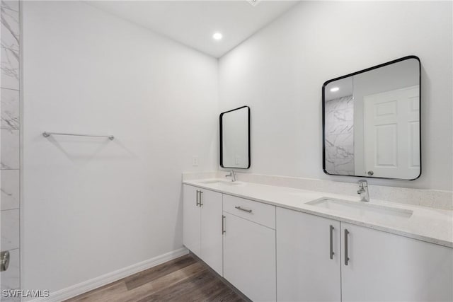 164 Thornton Ave S, Lehigh Acres, FL 33974 - bathroom featuring hardwood / wood-style flooring and vanity