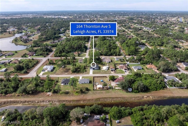 164 Thornton Ave S, Lehigh Acres, FL 33974 - bird's eye view with a water view