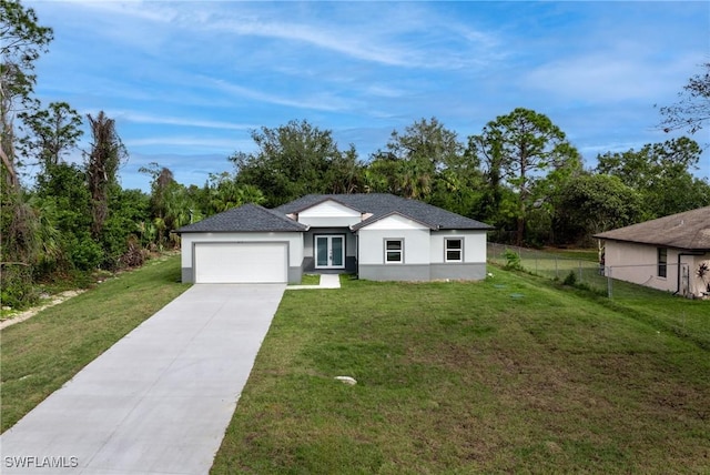 view of front of house with a front yard and a garage