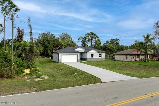 view of front of home featuring a front lawn and a garage