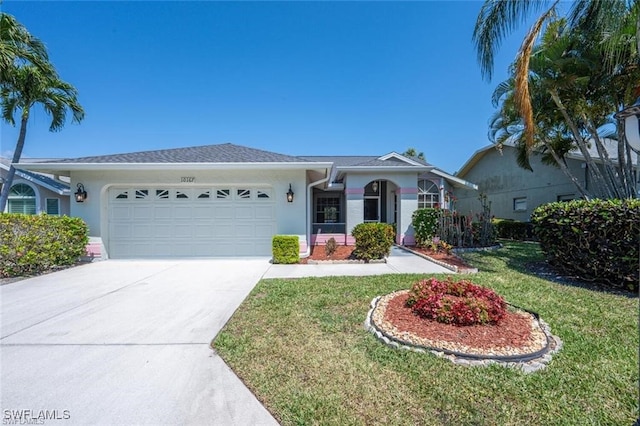 single story home with a garage and a front lawn