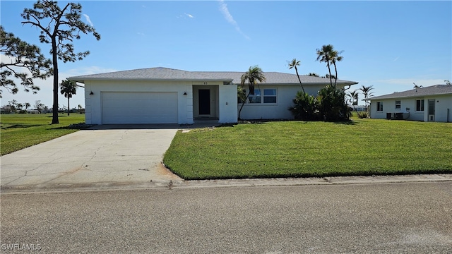 single story home featuring a front yard and a garage