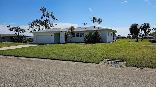 ranch-style house with a front lawn and a garage