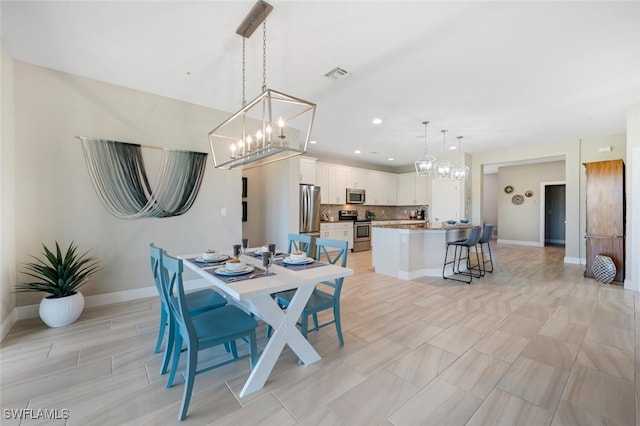 dining room with a notable chandelier