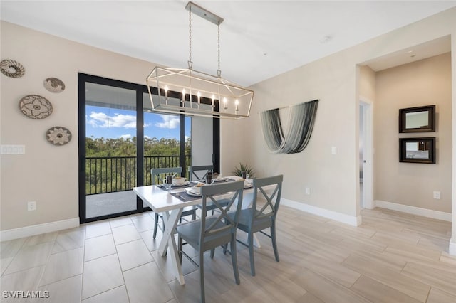 dining space featuring an inviting chandelier