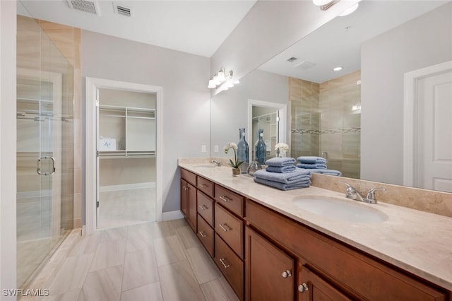 bathroom featuring walk in shower and vanity