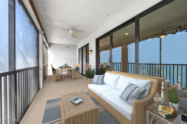 sunroom / solarium with a wealth of natural light and ceiling fan