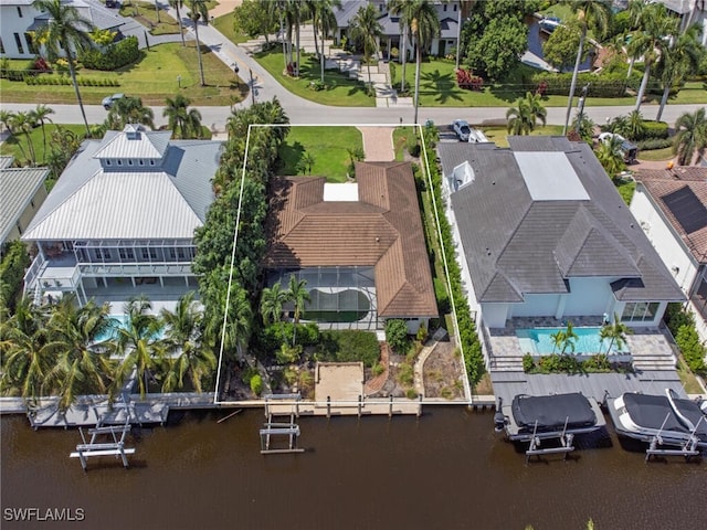 birds eye view of property featuring a water view