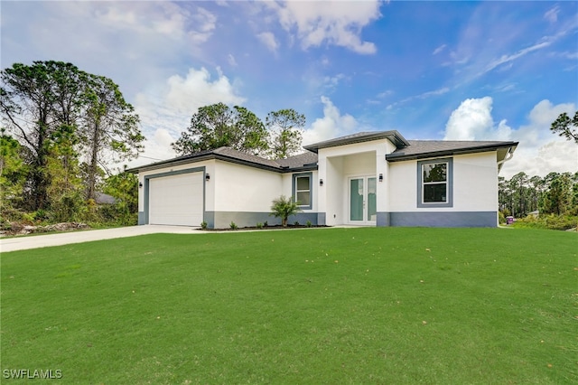 view of front of house featuring a front lawn and a garage