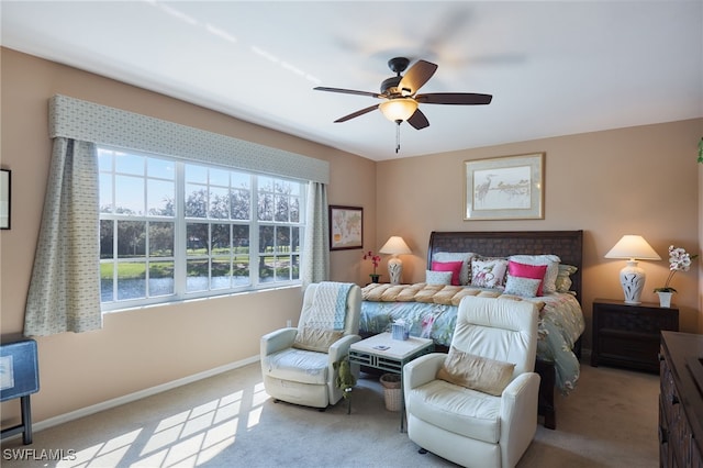 bedroom featuring light carpet and ceiling fan