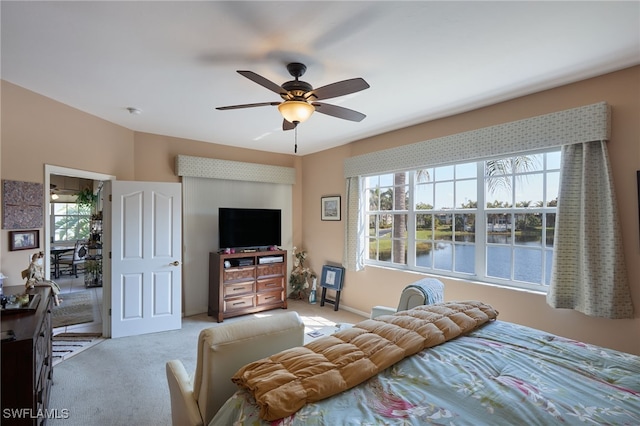 bedroom with ceiling fan and carpet