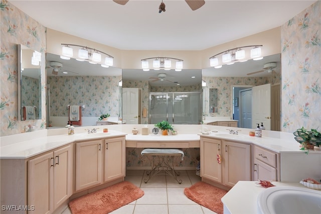 bathroom featuring vanity, a shower with shower door, and tile patterned flooring