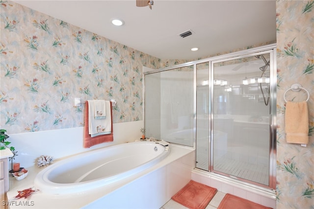 bathroom featuring tile patterned flooring and separate shower and tub