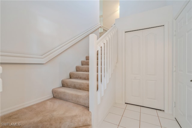 stairs featuring tile patterned floors