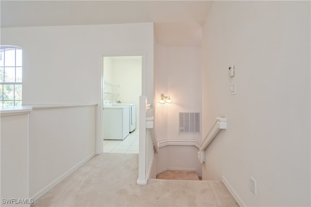 interior space featuring carpet flooring and washing machine and dryer