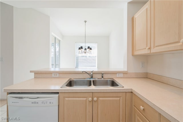 kitchen featuring light brown cabinetry, sink, dishwasher, decorative light fixtures, and an inviting chandelier