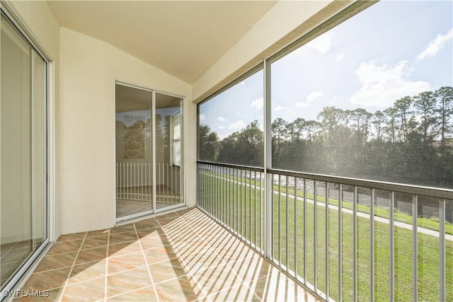 unfurnished sunroom with vaulted ceiling