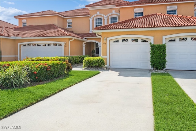 mediterranean / spanish house featuring a garage