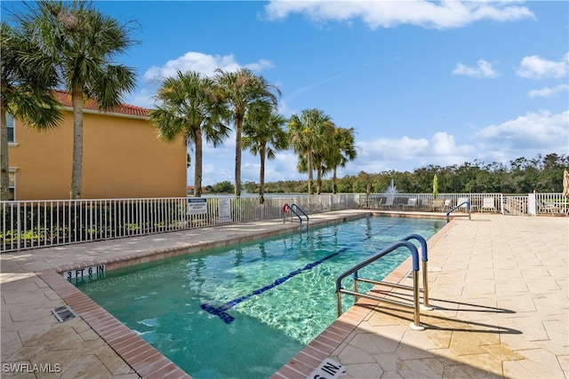 view of swimming pool with a patio area