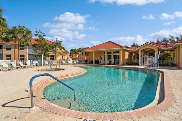 view of swimming pool featuring a patio area