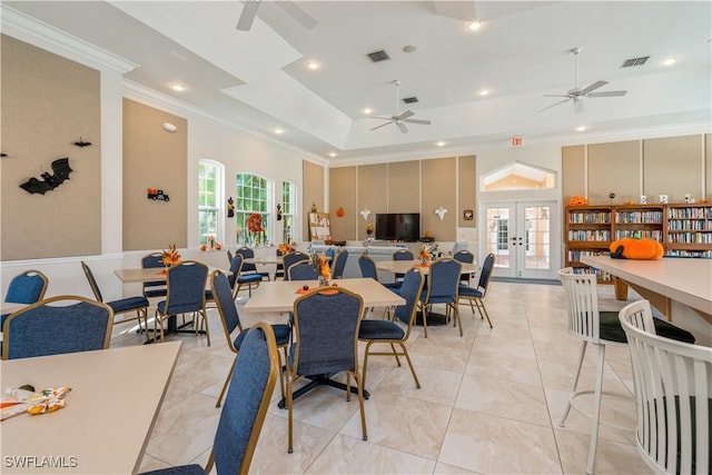 dining room with french doors, ornamental molding, and ceiling fan