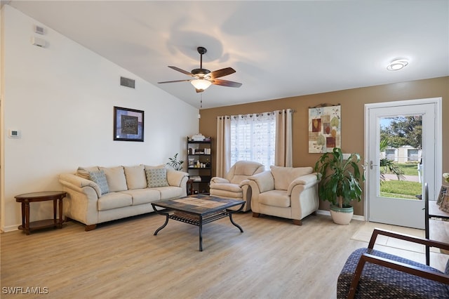 living room with lofted ceiling, light hardwood / wood-style flooring, a healthy amount of sunlight, and ceiling fan