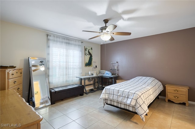 tiled bedroom featuring ceiling fan