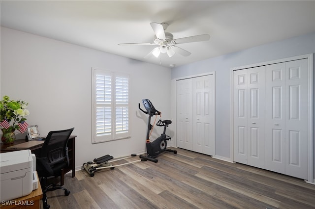 home office with hardwood / wood-style floors and ceiling fan