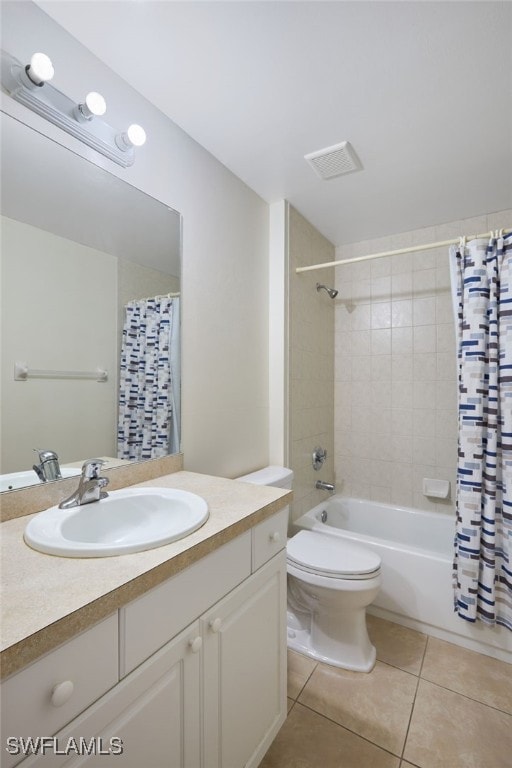 full bathroom with toilet, shower / bath combo, vanity, and tile patterned floors