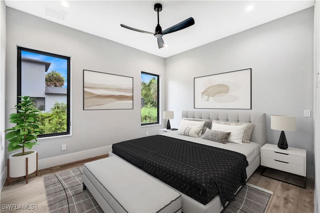 bedroom featuring light wood-type flooring and ceiling fan