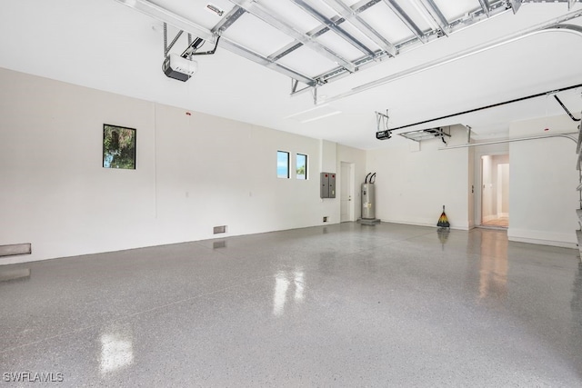 garage with a garage door opener, water heater, and electric panel