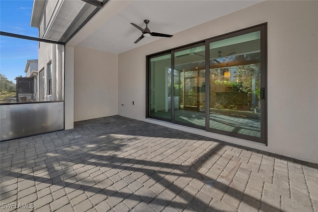 view of patio with a lanai and ceiling fan