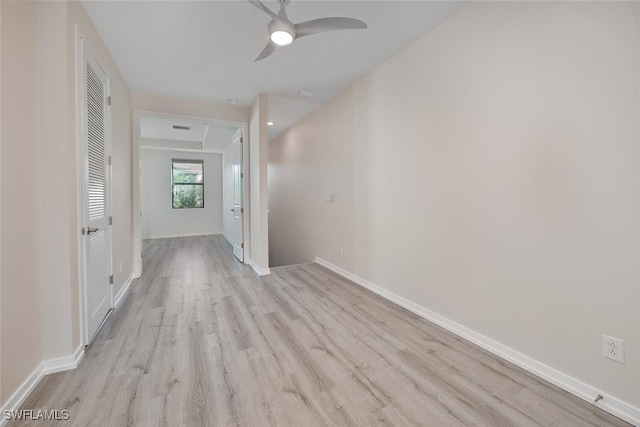 hall with light hardwood / wood-style floors