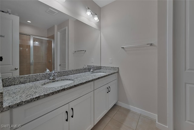 bathroom featuring vanity, tile patterned floors, and an enclosed shower