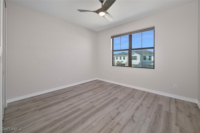 empty room featuring ceiling fan and light wood-type flooring