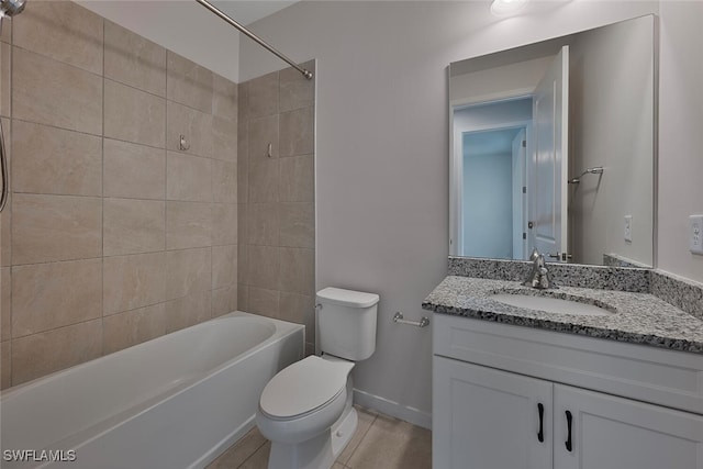 full bathroom featuring toilet, tiled shower / bath combo, vanity, and tile patterned flooring