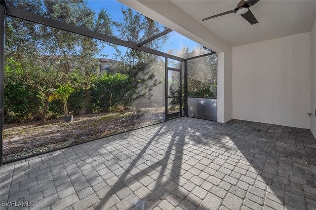 view of patio / terrace with a lanai and ceiling fan