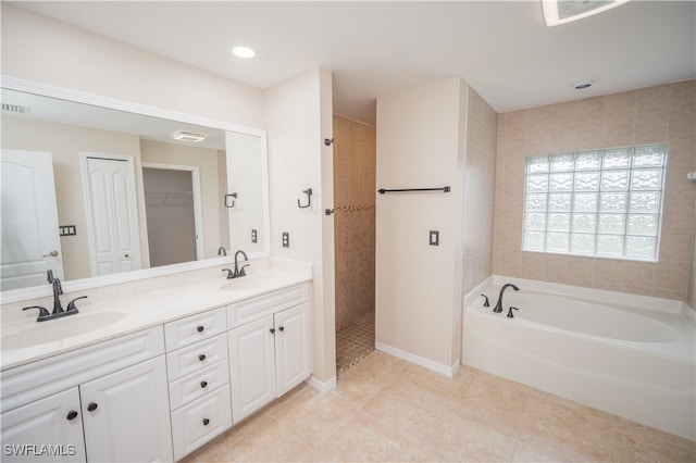 bathroom with vanity, shower with separate bathtub, and tile patterned flooring