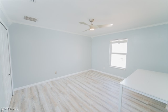 unfurnished room with crown molding, light wood-type flooring, and ceiling fan