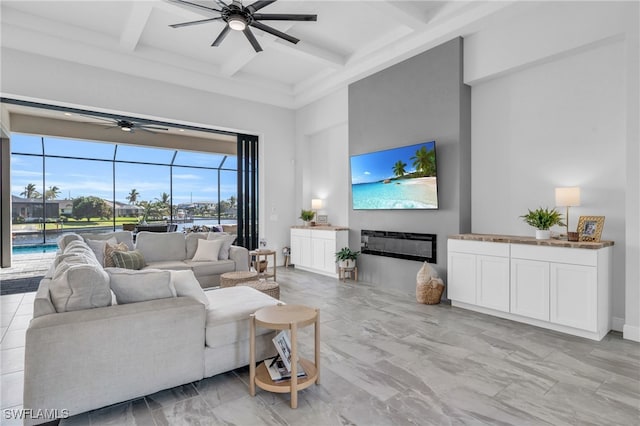 living room featuring beamed ceiling, coffered ceiling, and ceiling fan