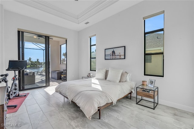 bedroom with crown molding, multiple windows, access to exterior, and a water view