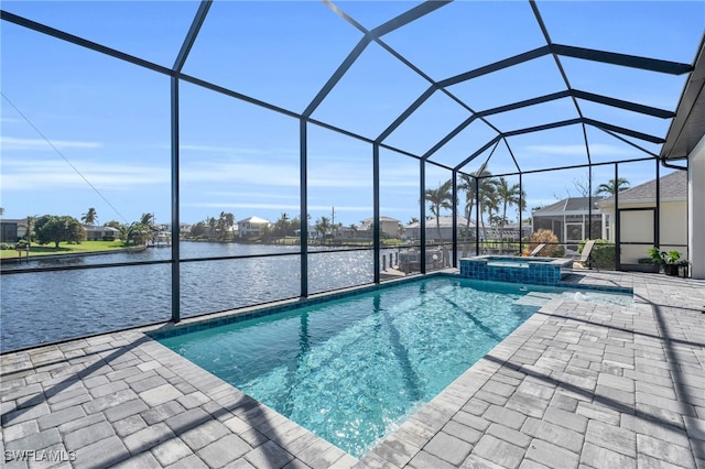 view of swimming pool featuring a patio area, an in ground hot tub, a water view, and glass enclosure