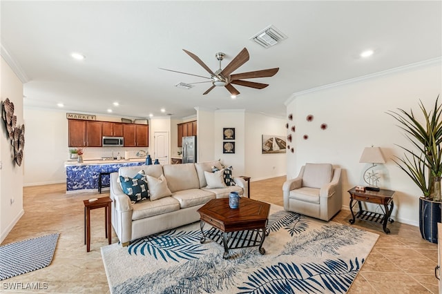 living area with visible vents, crown molding, baseboards, light tile patterned floors, and recessed lighting