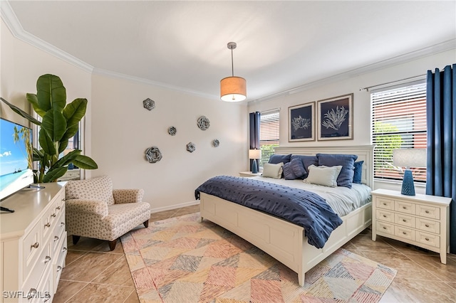 bedroom featuring crown molding and baseboards