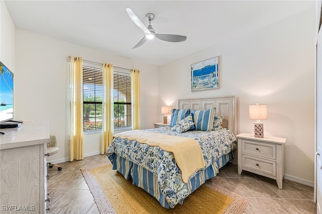 bedroom with light tile patterned floors and ceiling fan