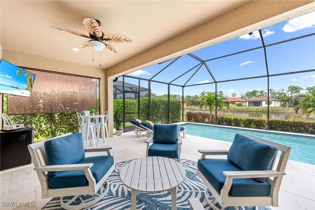 view of patio / terrace with ceiling fan, an outdoor living space, and glass enclosure