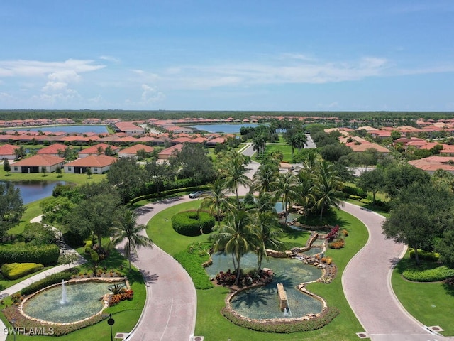 bird's eye view featuring a water view and a residential view